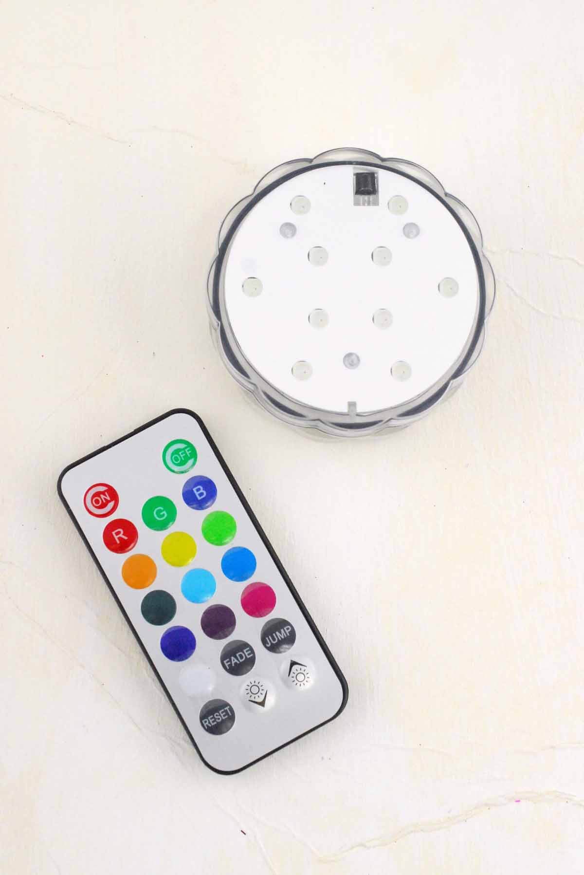 https://www.save-on-crafts.com/cdn/shop/products/led-submersible-light-disc-rgb-1_1200x.jpg?v=1605104659